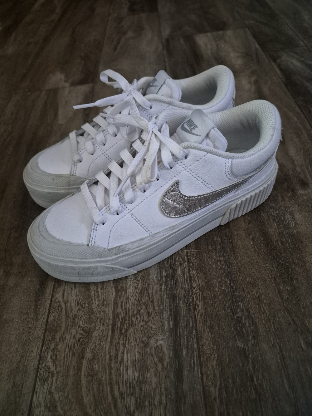 Nike White Platform Sneakers with Silver Swoosh